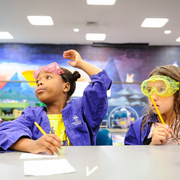 Little Girls performing a science experiment